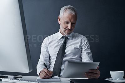 Buy stock photo Ceo, tablet and mature man writing in studio isolated on a dark background mockup space. Technology, notes and happy manager at desk for working on audit project, reading email online or business app