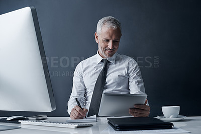 Buy stock photo Tablet, ceo and senior man writing in studio isolated on a dark background mockup space. Technology, notes and happy manager at desk for working on audit project, reading email online or business app