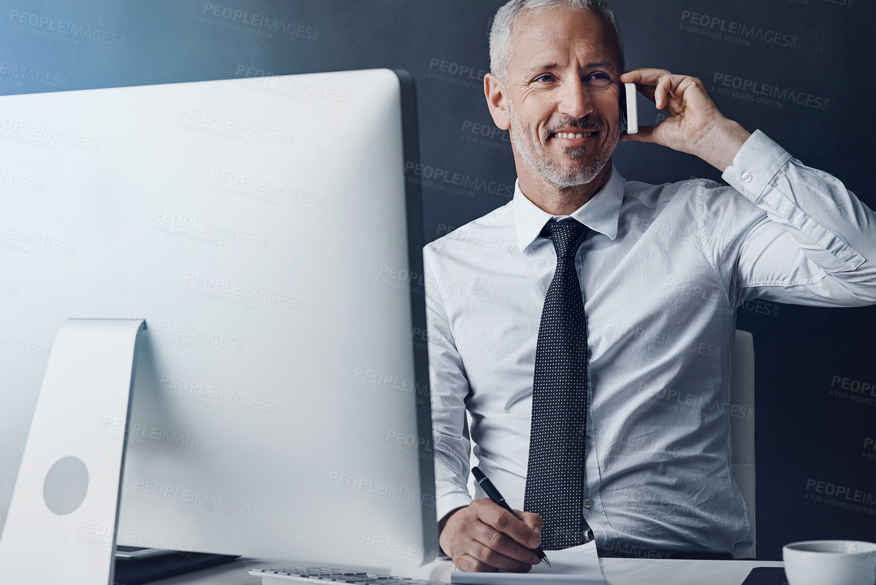 Buy stock photo Online communication, mature businessman on a phone call and against studio background with computer at desk, Happy or connectivity, social networking or crm and male person with smartphone planning