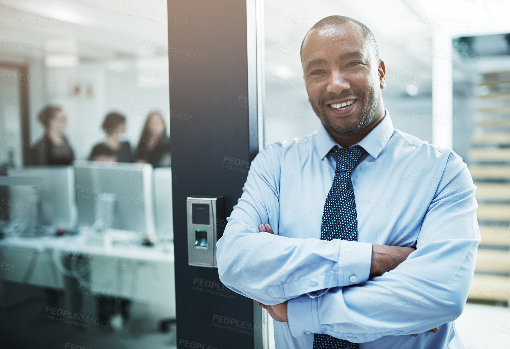 Buy stock photo Arms crossed, doorway and portrait of business man in professional workplace for start of career. Entrance, leaning and smile of happy African employee in company office for ambition or mission