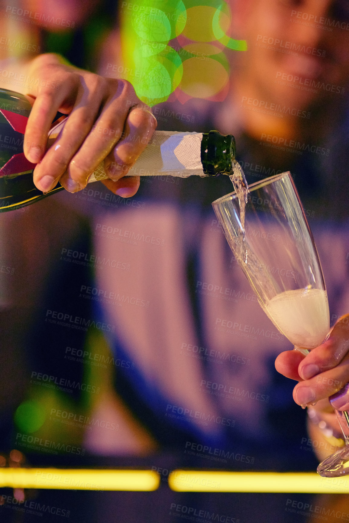 Buy stock photo Hands, night club and pouring champagne in glass for fun, party and night out to enjoy. Alcohol, sparkle and person with smile at bar or pub as waiter with bottle, celebration and enjoy as bartender