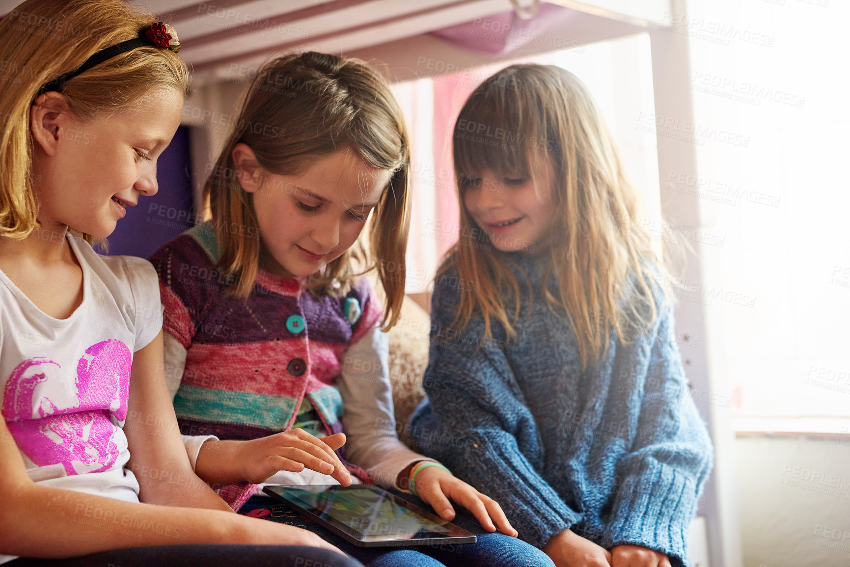 Buy stock photo Cropped shot of a group of little girls using a digital tablet