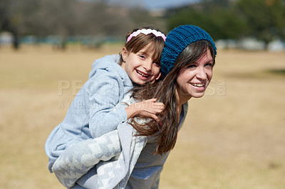 Buy stock photo Portrait of a mother and daughter bonding together at the park