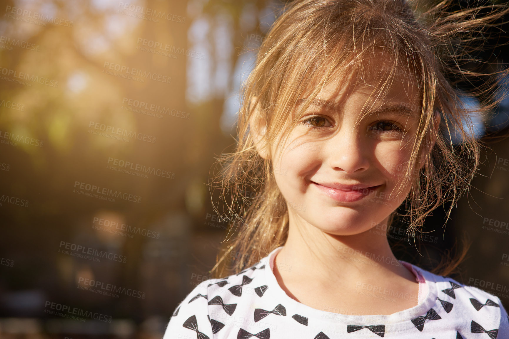 Buy stock photo Portrait of a little girl enjoying some time outdoors