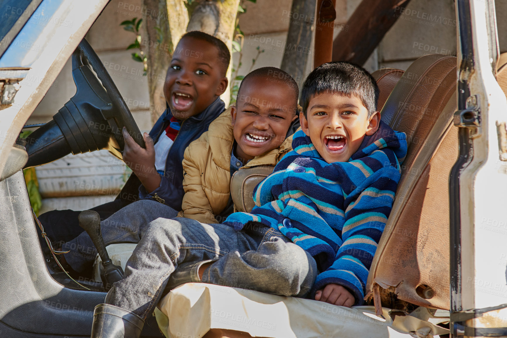 Buy stock photo Broken, old car and portrait of kid friends playing in countryside for fun, learning or bonding outdoor together. Abandoned, vehicle or boy children with diversity, happy or childhood racecar fantasy