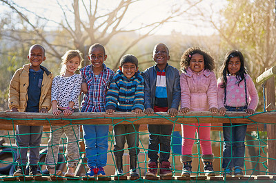 Buy stock photo Portrait of a group of little children standing together outside