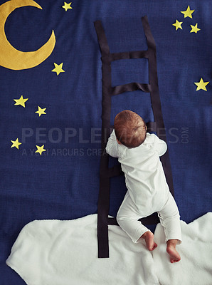 Buy stock photo Concept shot of an adorable baby boy climbing a ladder against an imaginary night time background