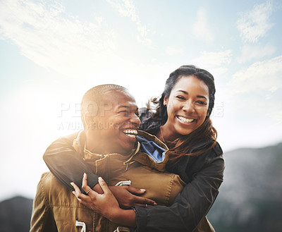 Buy stock photo Portrait of a happy young couple having fun outside