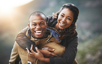 Buy stock photo Portrait of a happy young couple having fun outside