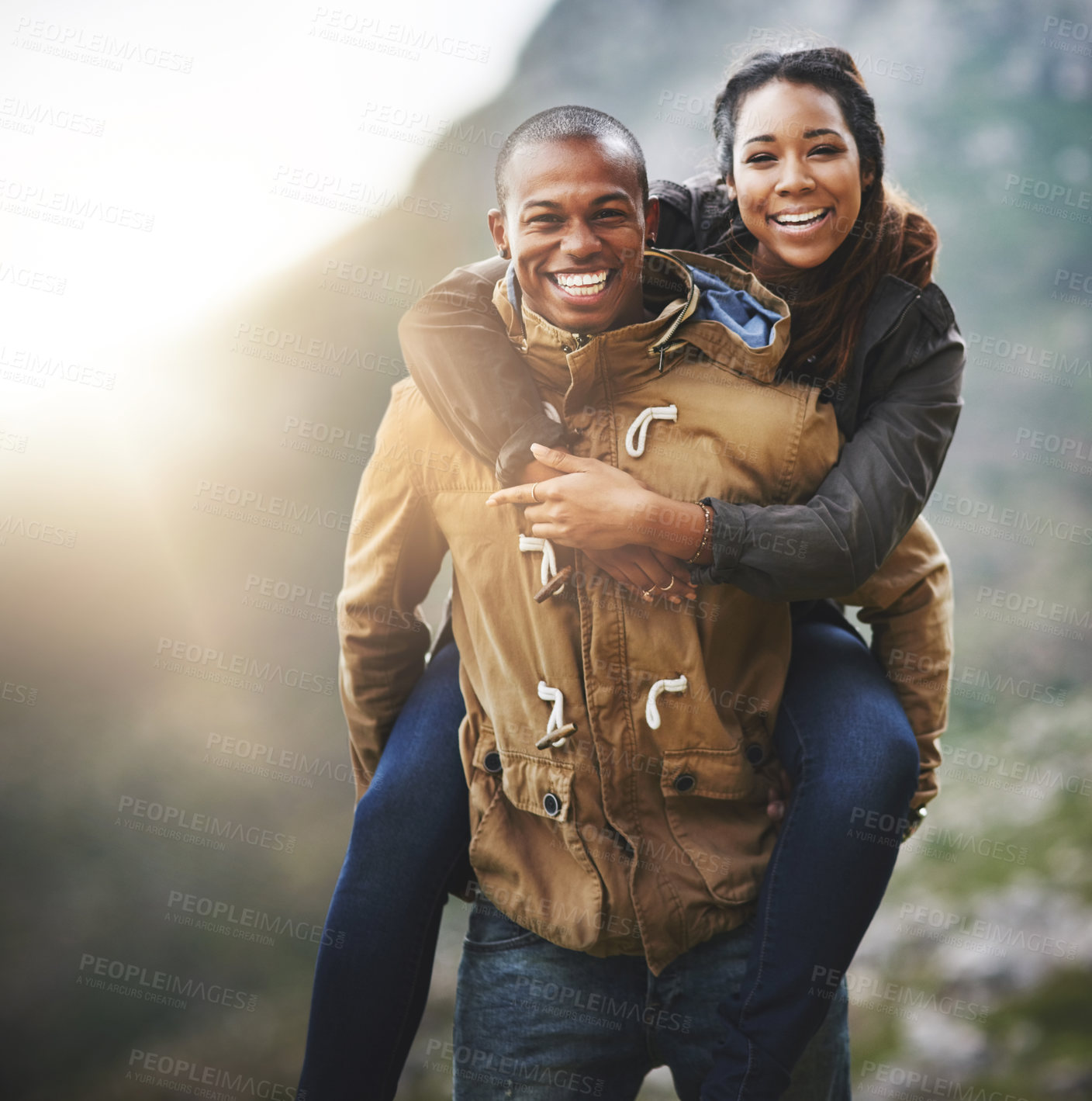 Buy stock photo Portrait of a happy young couple having fun outside
