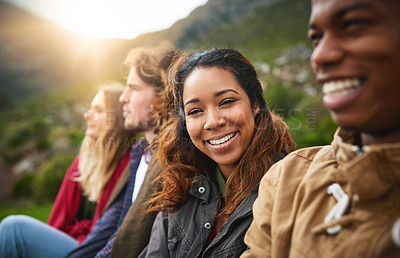 Buy stock photo Portrait of a happy young woman hanging out with her friends outside