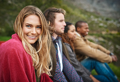 Buy stock photo Portrait of a happy young woman hanging out with her friends outside