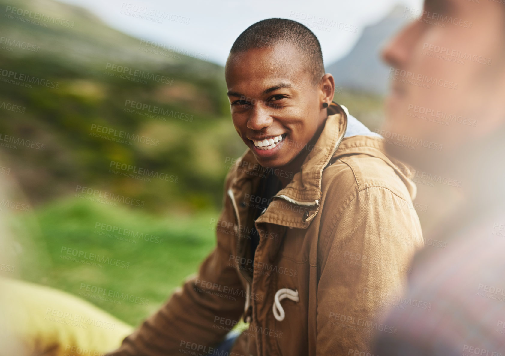 Buy stock photo Happy, park and portrait of man with friends for bonding, social gathering and together outdoors. Smile, relax and men and women on grass in nature for holiday, vacation and adventure on weekend