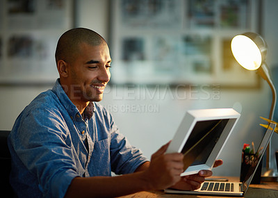 Buy stock photo Man, happy or photo frame at desk with laptop for late work, good memories or nostalgia at night. Thinking, male editor or holding picture for sentiment in office at computer, after hours or deadline