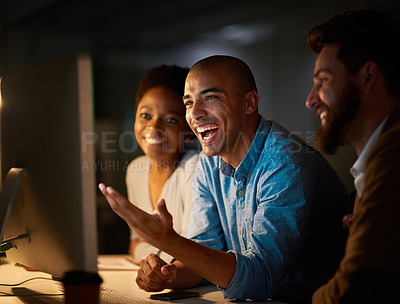 Buy stock photo Cropped shot of a group of colleagues working late in an office