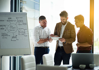 Buy stock photo Cropped shot of a group of colleagues having a discussion in an office