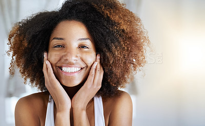 Buy stock photo Portrait of an attractive young woman going through her morning beauty routine
