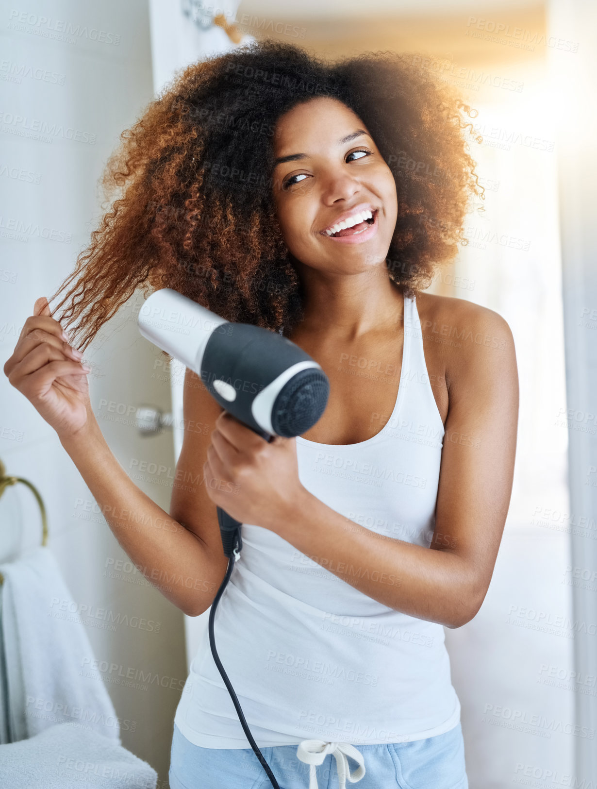 Buy stock photo Girl, happy and hair dryer for hairstyle in bathroom, heat treatment and electric appliance. Female person, cosmetics and home for beauty or curly volume, grooming and confidence in dermatology