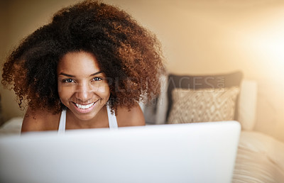 Buy stock photo Portrait of a relaxed young woman using a laptop on her bed in the morning