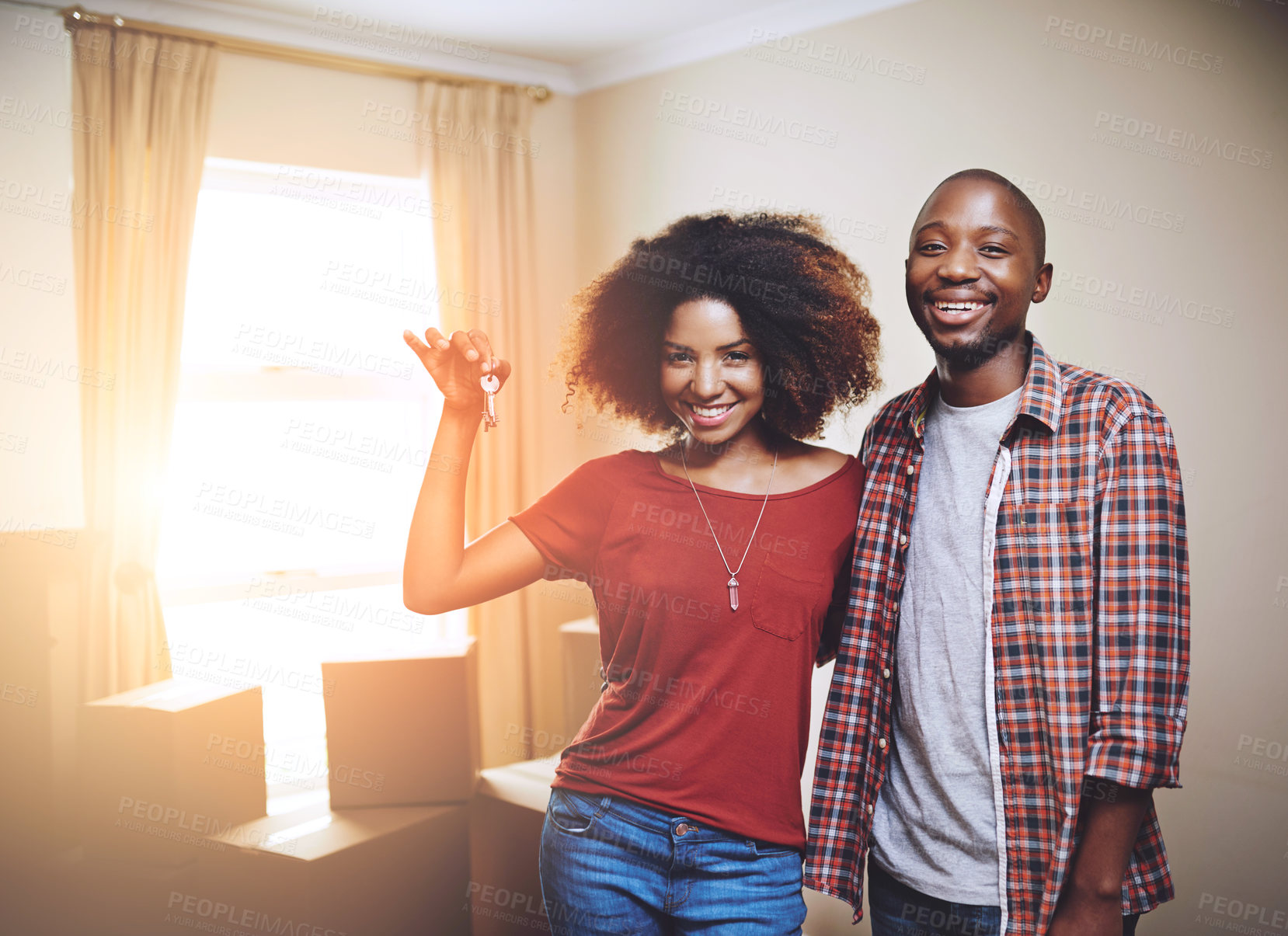 Buy stock photo Portrait of a young couple moving into their new home