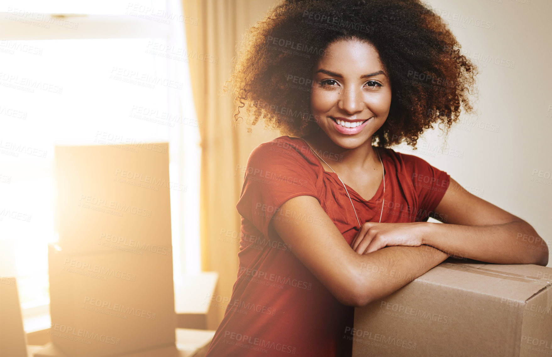 Buy stock photo Portrait of a young woman moving into her new home