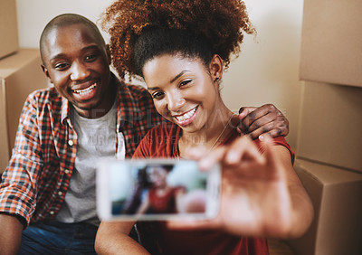 Buy stock photo Black couple, selfie and smile on floor with boxes for new house, bonding or break from moving with memory. People, homeowner and excited for property investment, dream home or profile picture update