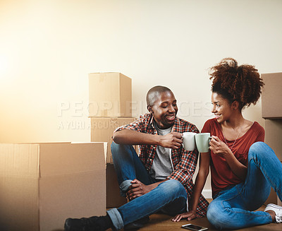 Buy stock photo Black couple, cheers and mug on floor of new house with bonding, support and celebration with coffee break. People, mockup space and toast for property investment, dream home or relocation with boxes