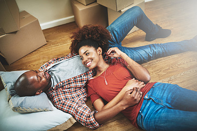 Buy stock photo Black couple, break and happy on floor of new house with bonding, support or relax with top view. People, homeowner or excited for property investment, dream home or real estate relocation with boxes