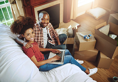 Buy stock photo Sofa, laptop and portrait of couple in new house with smile for real estate, investment or mortgage loan. Man, woman and box with tech in high angle for marriage, relocation and planning of property