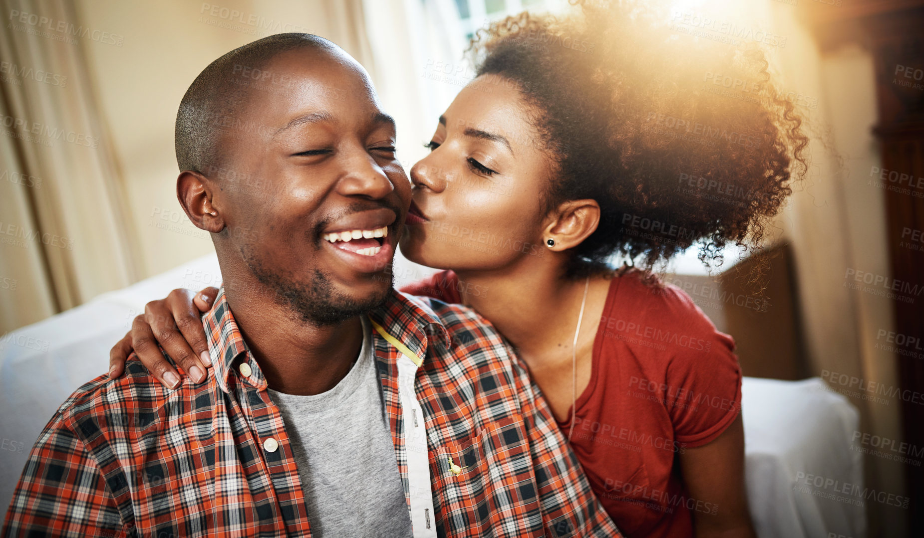 Buy stock photo Cropped shot of an affectionate young couple enjoying the day at home