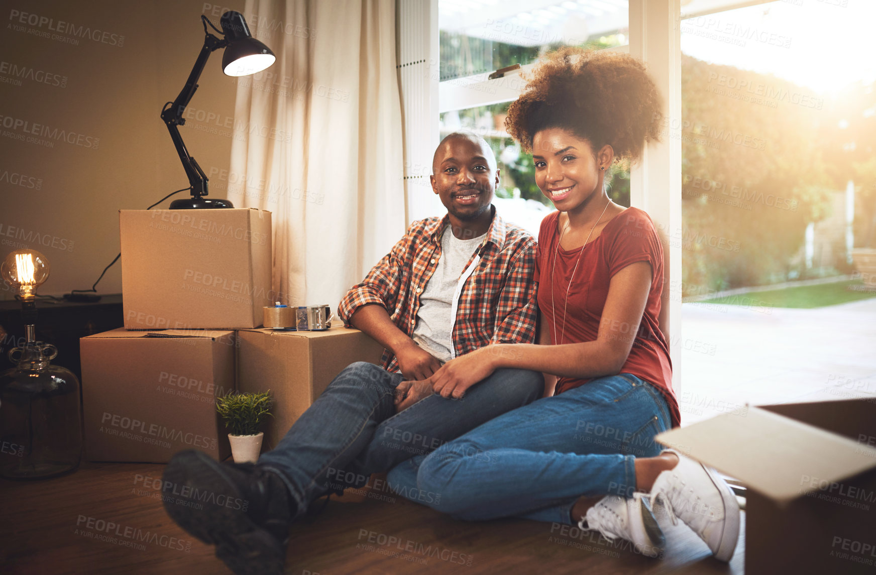 Buy stock photo Black couple, portrait and smile on floor of new house with bonding, support and break or relax from moving. People, homeowner and excited for property investment, dream home or relocation with boxes