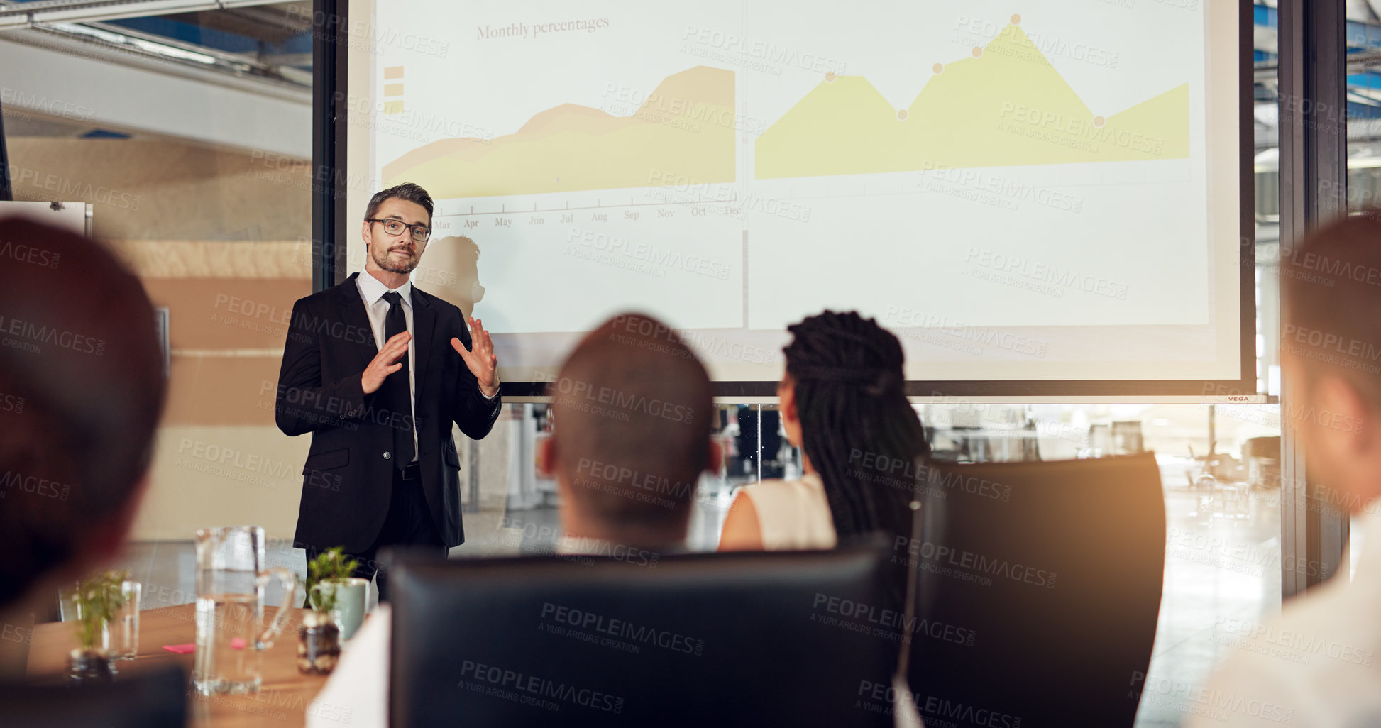 Buy stock photo Businessman, presentation and meeting audience with graphs in boardroom for financial analysis, charts or report. Colleagues, office and review for company accounting or budget, investment or growth