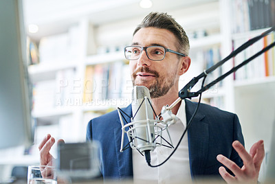Buy stock photo Shot of a businessman talking through a microphone at his computer