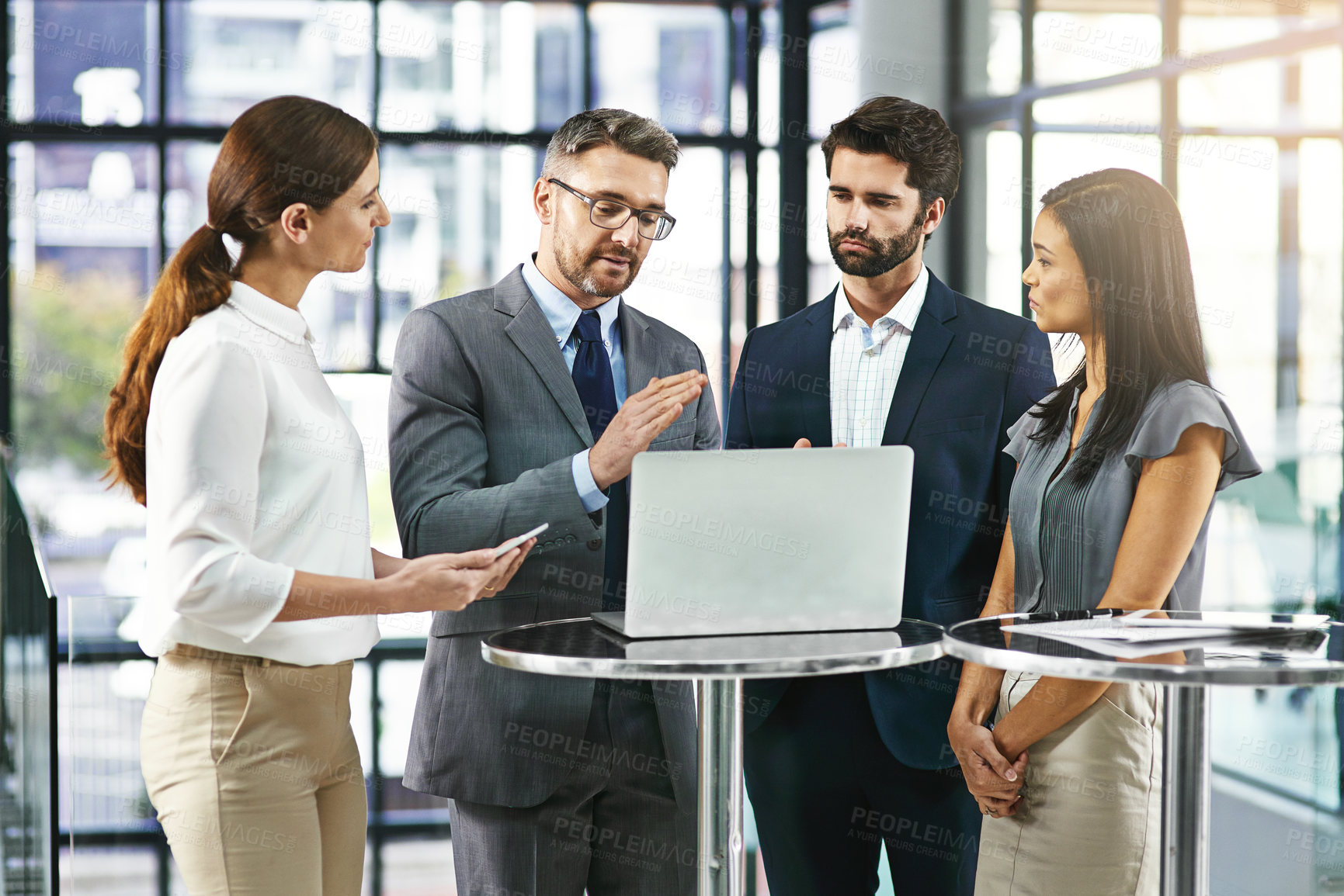 Buy stock photo Coaching, training and collaboration, team and laptop in discussion on project management with manager. Leadership, planning and brainstorming, male mentor and teaching business colleagues in office