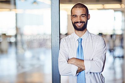 Buy stock photo Portrait of a smiling young professional standing in a modern office