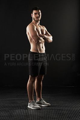 Buy stock photo Studio portrait of a sporty young man isolated on black