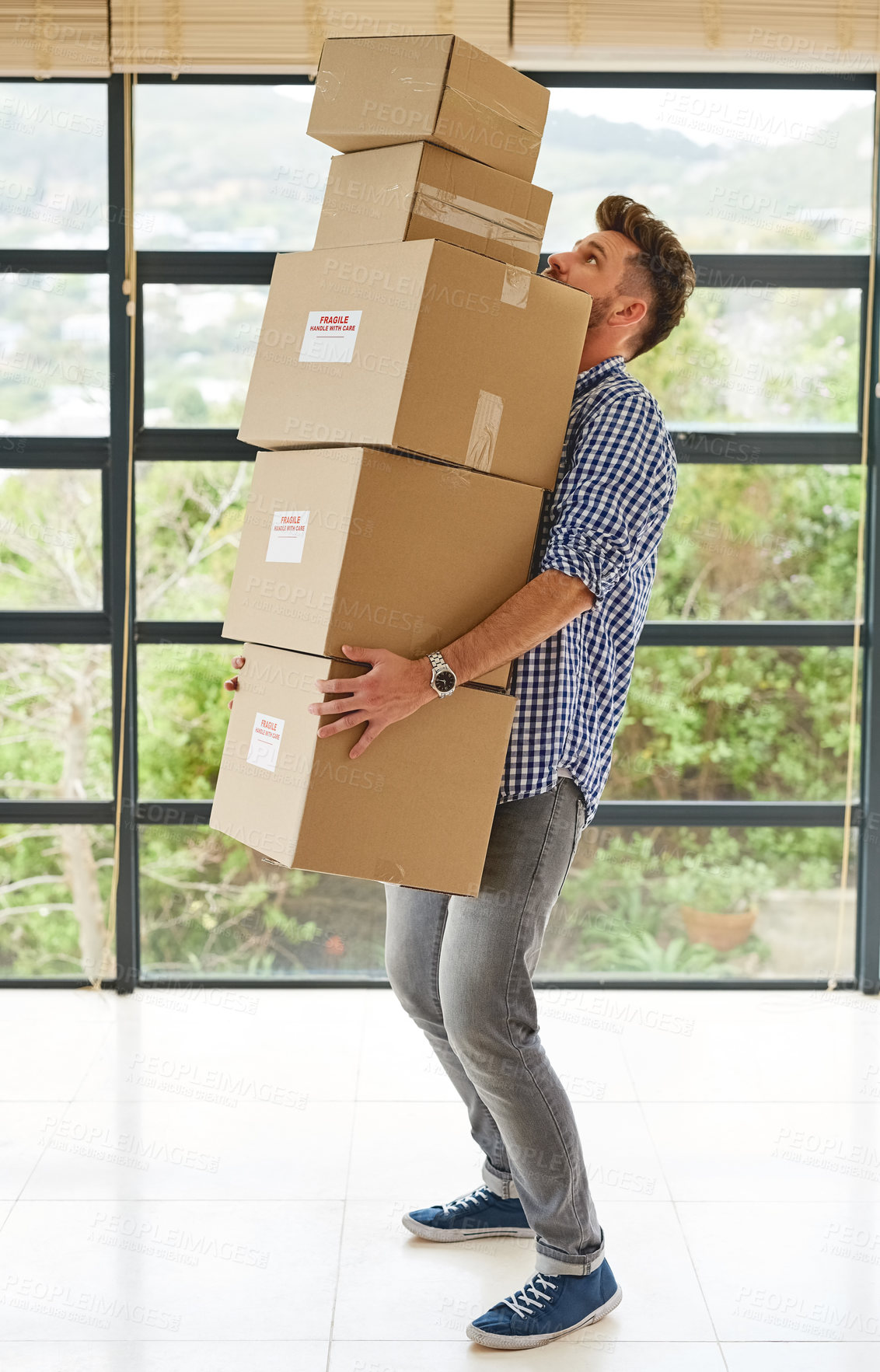 Buy stock photo Man, moving and carry a pile of boxes in house with transport, delivery or home relocation. Lifting, package and person walking in apartment or real estate to rent with help of courier or support