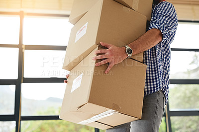Buy stock photo Cropped shot of an unidentifiable man carrying a pile of boxes while moving house