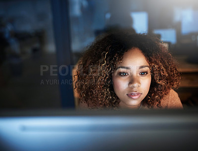 Buy stock photo Shot of a young woman working late in an empty office