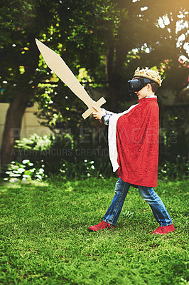 Buy stock photo Kid, costume and vr for fun, play and cyber fantasy with cardboard sword in garden. King, crown and boy with smile, home and dress up adventure with virtual reality entertainment with headset