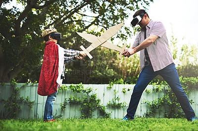 Buy stock photo Father, son and playing with sword fight for bonding or VR in costume, cosplay or backyard at home. Fun dad, child or little boy enjoying outdoor game on grass field, lawn or virtual reality at house