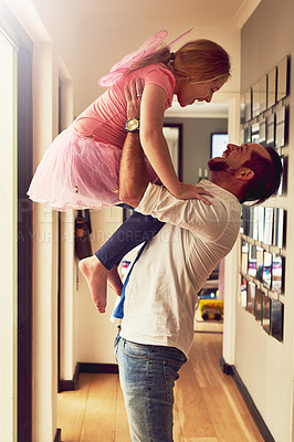 Buy stock photo Cropped shot of a father spending quality time with his little daughter at home