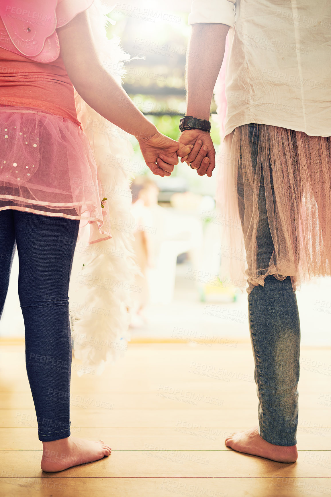 Buy stock photo Holding hands, love or dad with princess or girl in house living room with pink costume, closeup or parent. Family, care or father with child or kid for dress up, pinky promise or games with wings