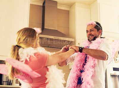 Buy stock photo Dancing, playing or dad with princess or girl on sofa in home with pink costume, smile or parent. Happy family, holding hands or father with child fairy for dress up, love or games with kid or music