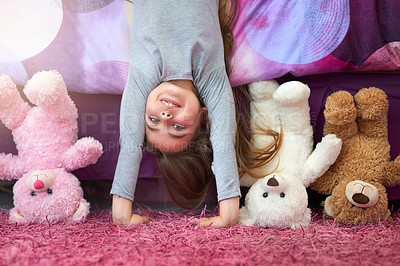 Buy stock photo Portrait of a cute little girl doing a handstand in her bedroom at home