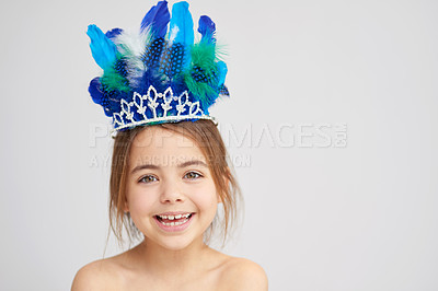 Buy stock photo Studio portrait of a cute little girl wearing a sparkly crown with feathers