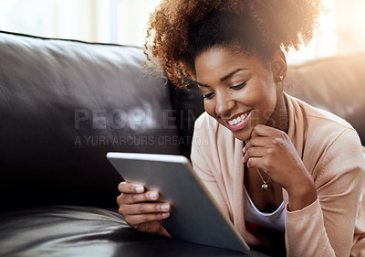 Buy stock photo Woman, sofa and home or happy on tablet, relax and internet communication or social media scrolling. Reading, text and blog or online networking, meme and funny on tech on couch in apartment