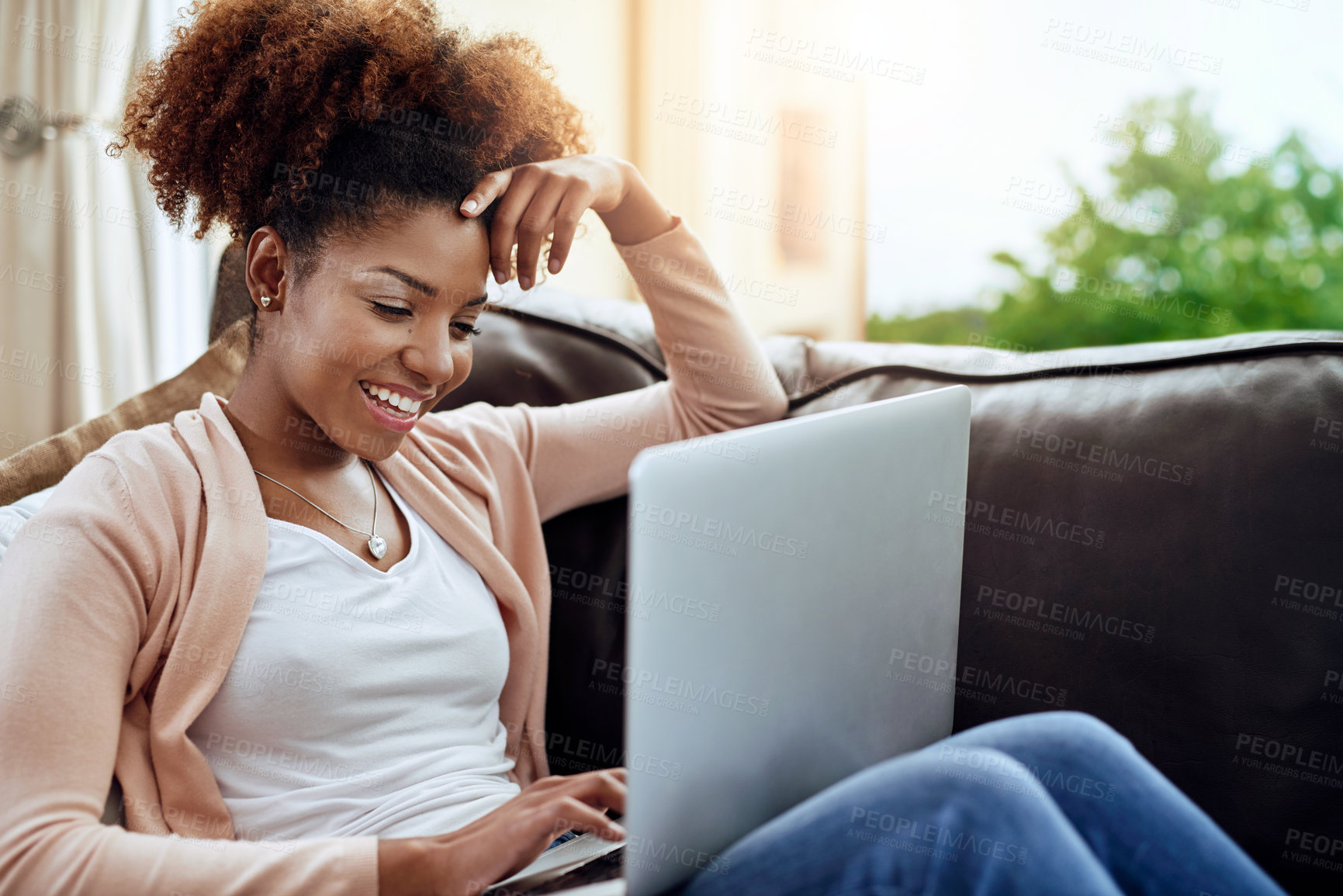 Buy stock photo Happy, african woman or student with laptop on couch for remote learning, study or streaming tv at home. Female person, computer and smile for online education, research or entertainment