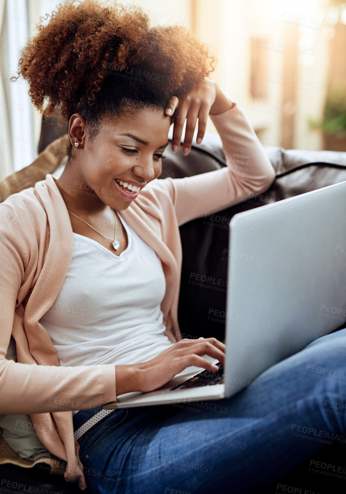 Buy stock photo Happy, african woman or student with laptop on sofa for remote work, online education for college at home. Female person, computer and smile on couch for elearning, homework or studying for test 