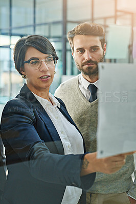 Buy stock photo Cropped shot of businesspeople brainstorming together in an office